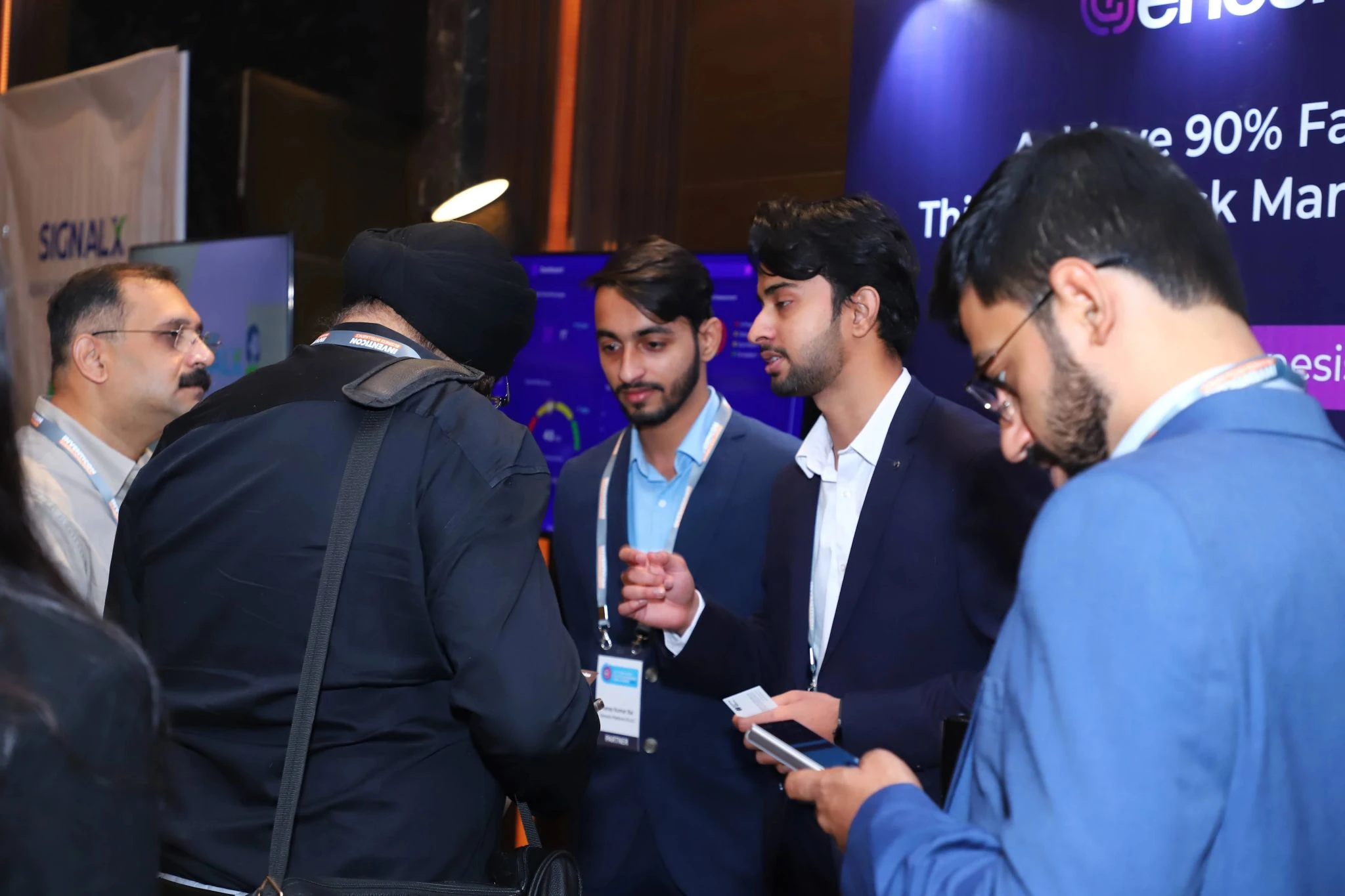 The Merqab team speaking with visitors at a cybersecurity event